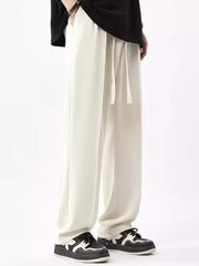 Men's ivory wide leg sweatpants with drawstring waist and pockets.