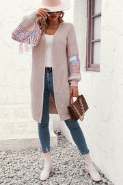 Dust Storm acrylic knit cardigan with colorful fringe sleeves and textured knit.