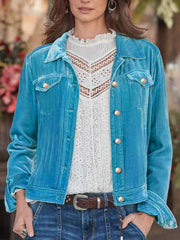 Cerulean velvet jacket with silver buttons and chest pockets, styled with a white lace top.