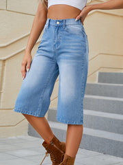 Denim culotte bermuda shorts in medium wash, cropped length, casual style.