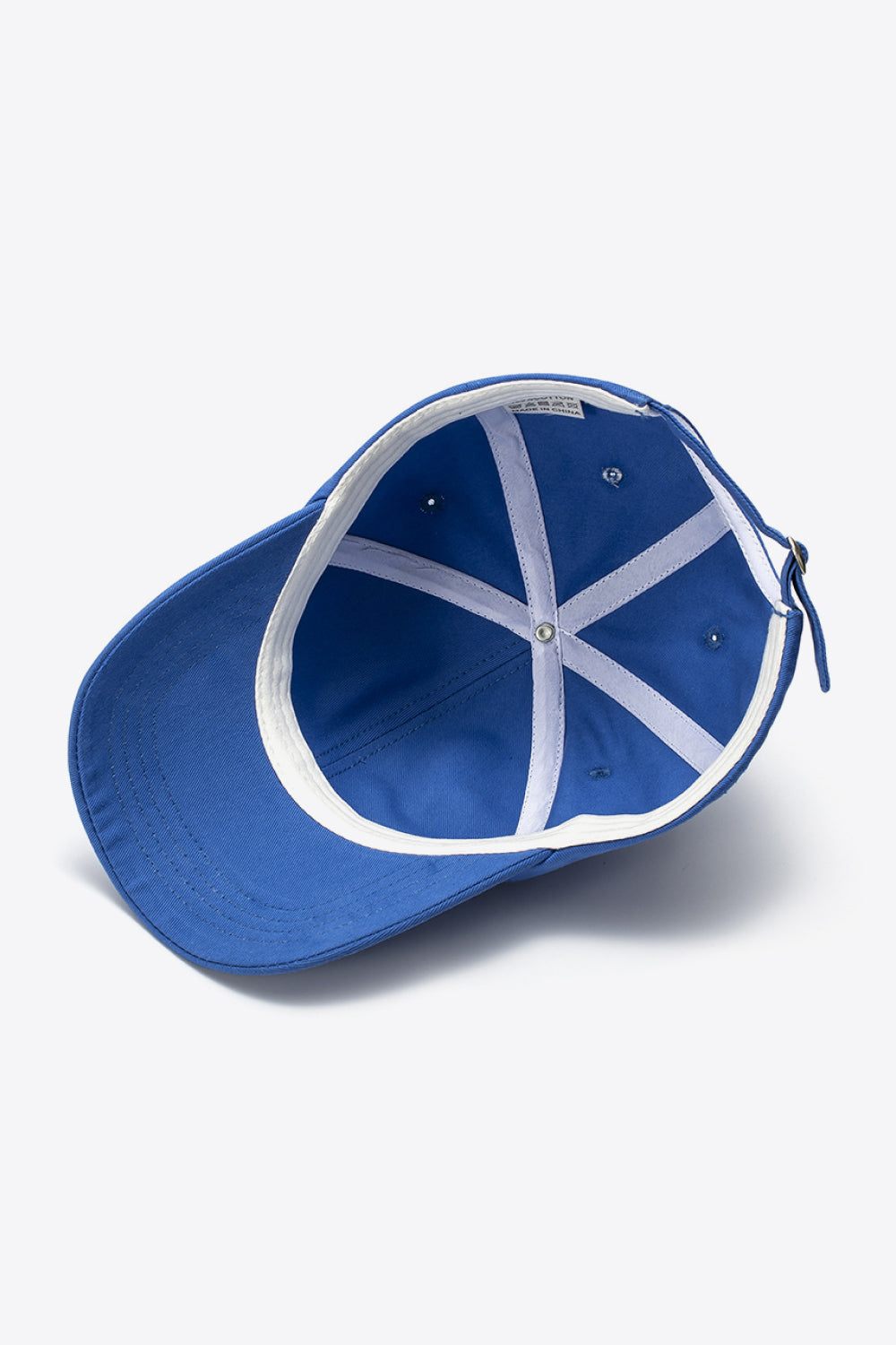 Cobalt blue cotton baseball cap interior view with adjustable strap