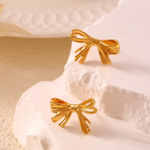 Golden bow stud earrings with a chic design.