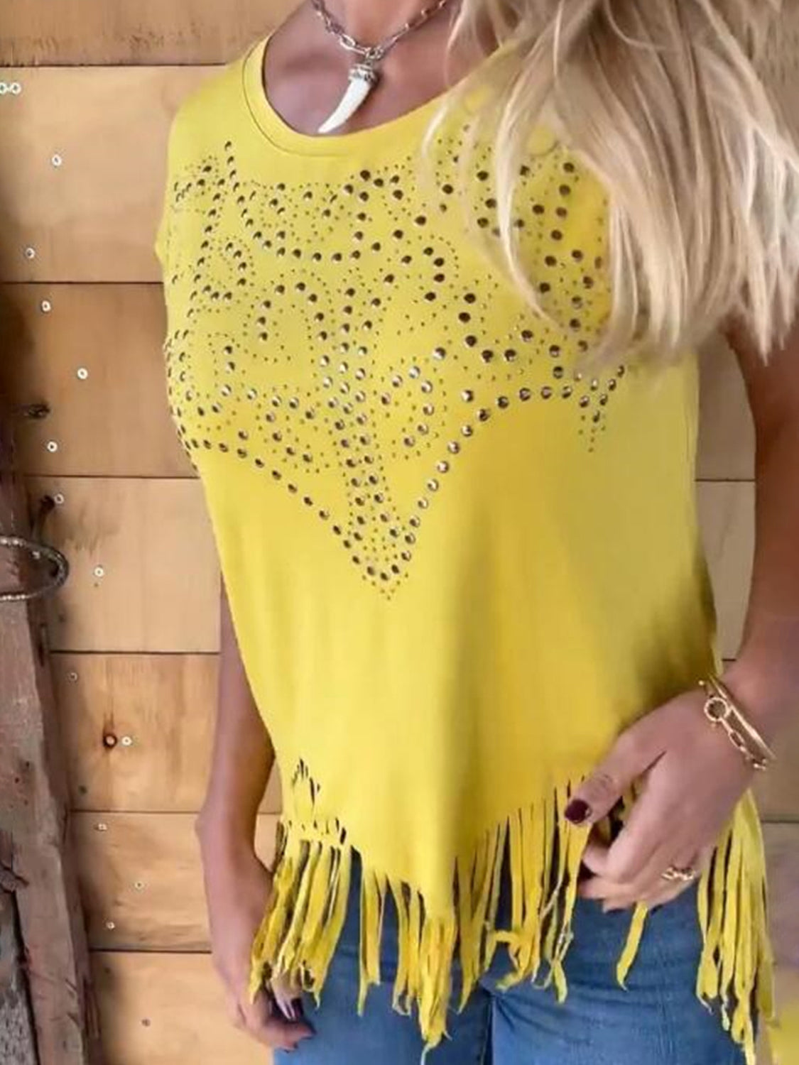 Yellow studded perforated tee with fringe hem and neckline detail