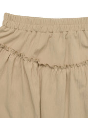 Tiered ruffle mini skirt in tan with elastic waistband and textured fabric.