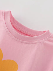 Pink cotton baby tee with orange floral graphic and ribbed neckline.