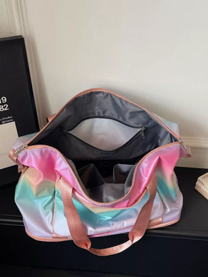 Iridescent gradient large duffel bag with pink straps and interior pockets.