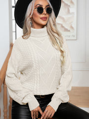 Cream cable knit turtleneck sweater with textured stitch details and relaxed fit.