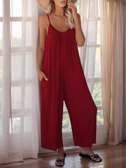 Burgundy gathered bodice wide-leg jumpsuit with spaghetti straps and pockets.