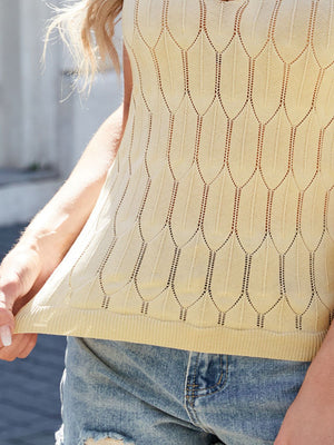 Tan knit scoop tank top with geometric leaf pattern and ribbed hem.