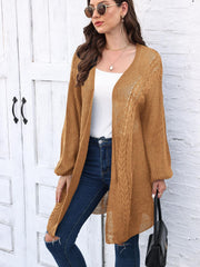 Caramel cable knit cocoon cardigan with open front and long sleeves.