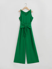 Emerald green tie-waist wide leg jumpsuit with V-neck and tie shoulder straps.