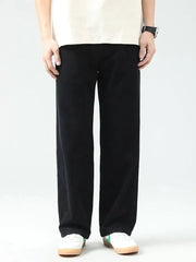 Black cotton wide leg jeans with a relaxed fit.