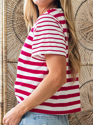 Red and white striped cotton blend t-shirt with round neck and short sleeves.