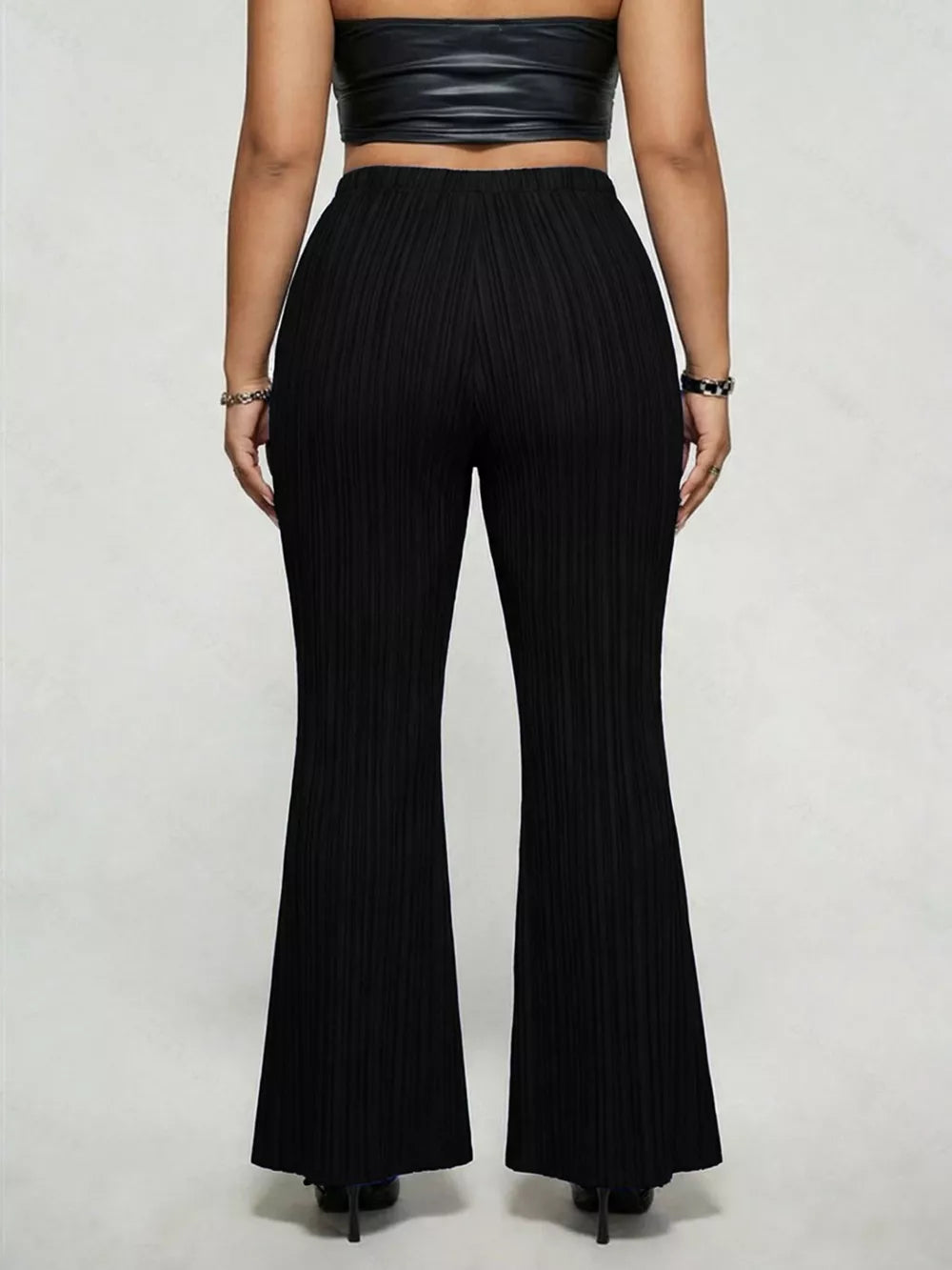 Black ribbed high-waist flare maternity trousers with a buckle detail.