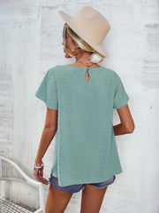 Light green Swiss dot blouse with flutter sleeves and keyhole back detail.