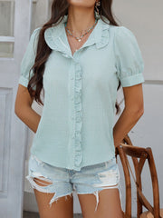 Light green seersucker blouse with ruffles and puff sleeves, buttoned front.