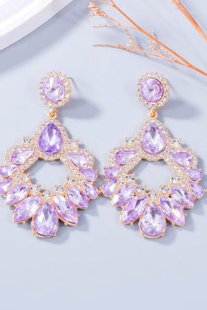 Floral-inspired drop earrings with purple crystals and gold alloy setting.