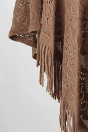 Camel crochet poncho with open knit pattern and fringe detail