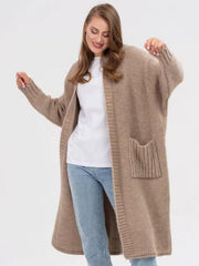 Oversized khaki knit cocoon cardigan with pockets and ribbed cuffs.