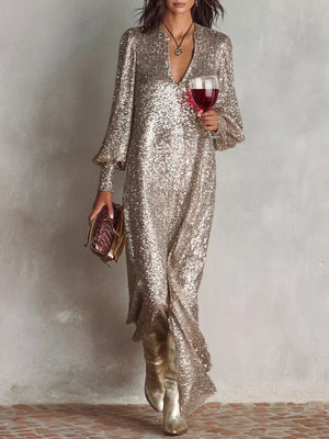 Champagne sequin maxi gown with lantern sleeves and deep V-neck.