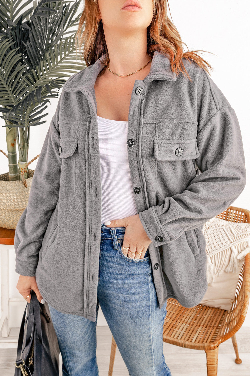 Fleece shirt jacket in Charcoal with patch pockets, button front, and collar.