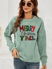 Sage corduroy sweatshirt with Merry Christmas Y'all graphic in buffalo plaid, leopard, and polka dot patterns.