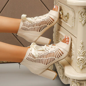 Beige lace-up chunky heel sandals with cut-out details and ribbon ties.