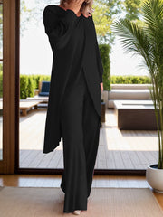 Black draped overlay palazzo co-ord set with wide-leg pants and long sleeves.