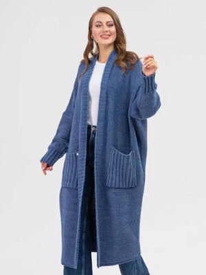 Dusty blue oversized knit cocoon cardigan with pockets and ribbed cuffs.
