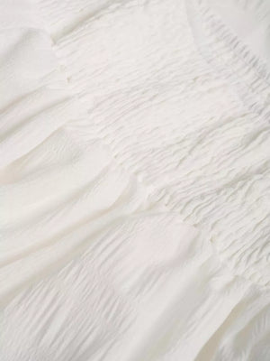 White crinkled tiered maxi skirt with smocked waist detail