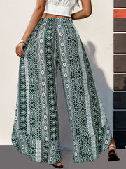 Geometric print palazzo pants in Air Force Blue with ruffle trim and wide legs.