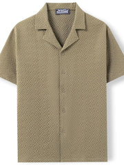 Textured resort collar shirt in moss with geometric pattern and button front.