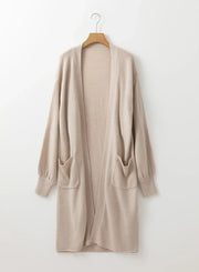 Oversized sleeve maxi cardigan in Dust Storm with two front pockets and ribbed cuffs.