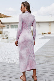 Tie-dye ruched midi dress in blush pink with mock neck and long sleeves.