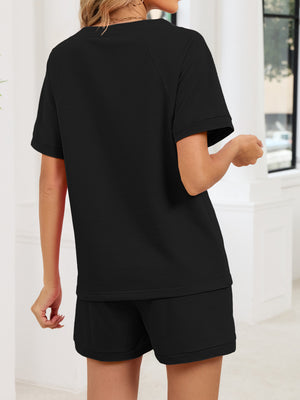 Black loungewear shorts and t-shirt set with drawstring waist, comfortable casual style.