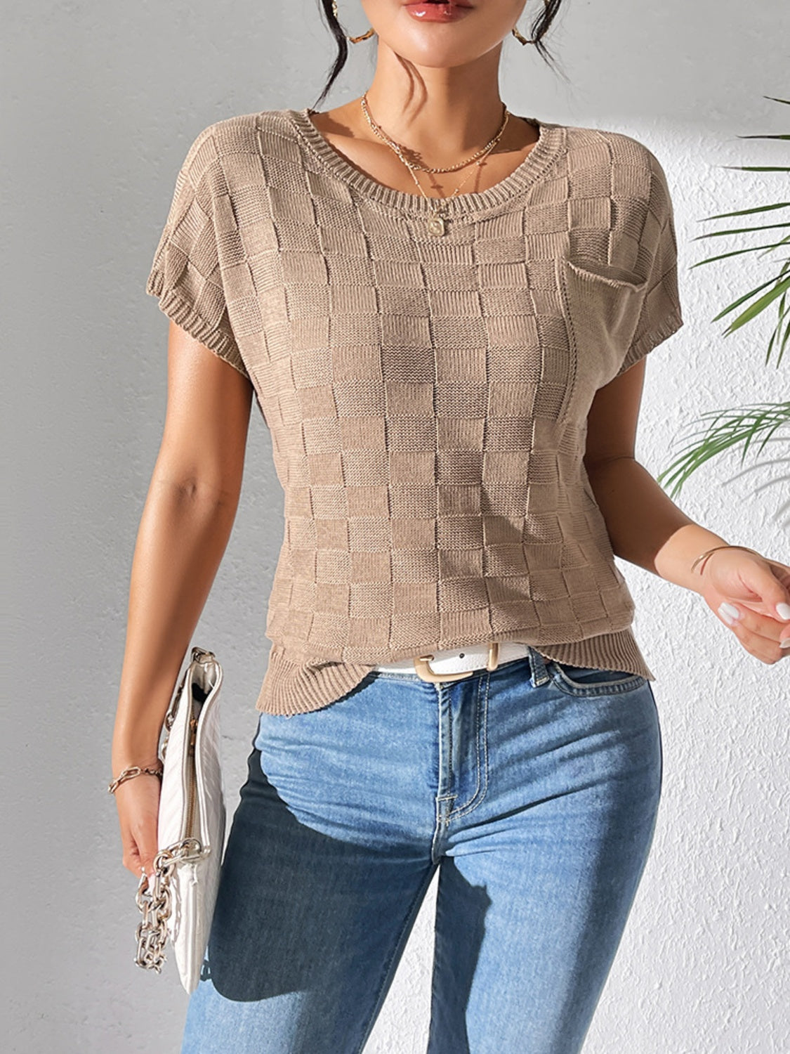 Camel textured check knit pocket tee with short sleeves and a crew neck.