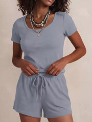 Blue scoop-neck tee and drawstring shorts set with button detail on shoulder.