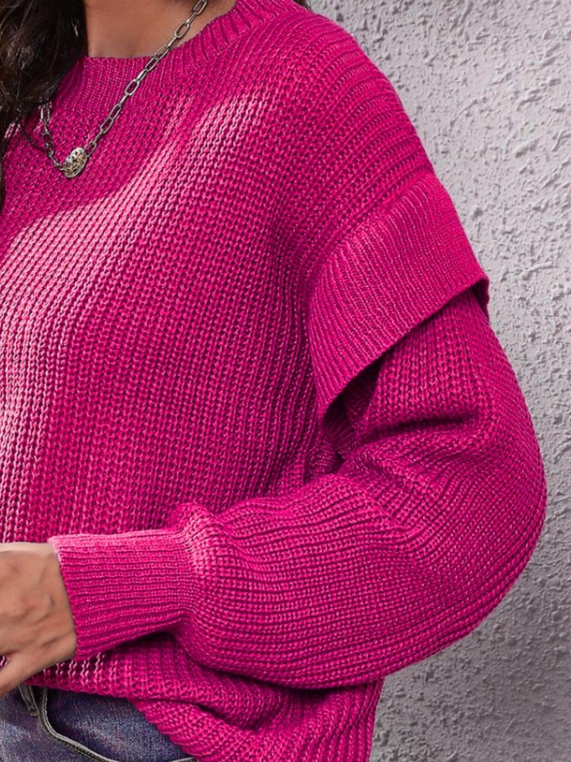 Cerise ruffled sleeve ribbed knit pullover sweater with crew neck.