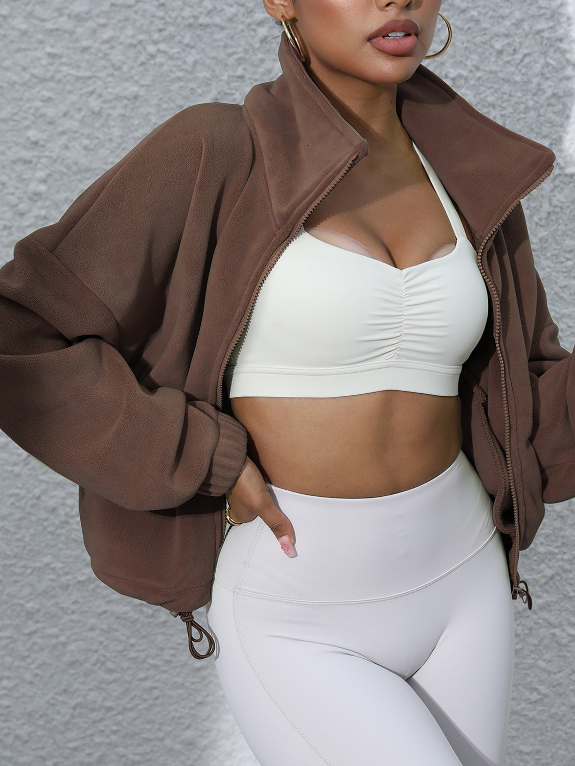 Coffee brown fleece cropped jacket with funnel neck and zipper closure.