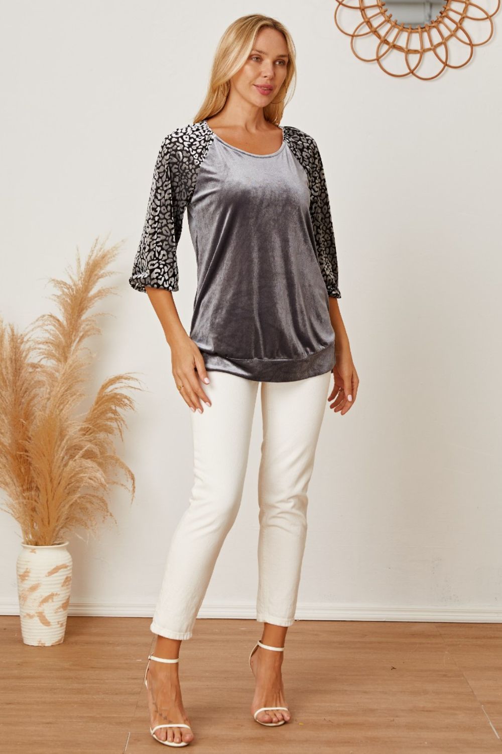Velvet raglan top in dark gray with leopard print 3/4 sleeves and scoop neck.