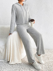 Light gray ribbed knit cropped hoodie and wide leg pants set with drawstring hood.
