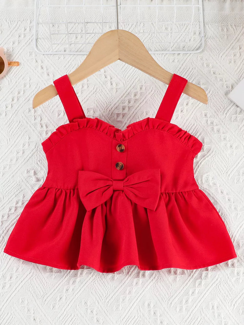 Red ruffle-trim baby top with bow and button detail
