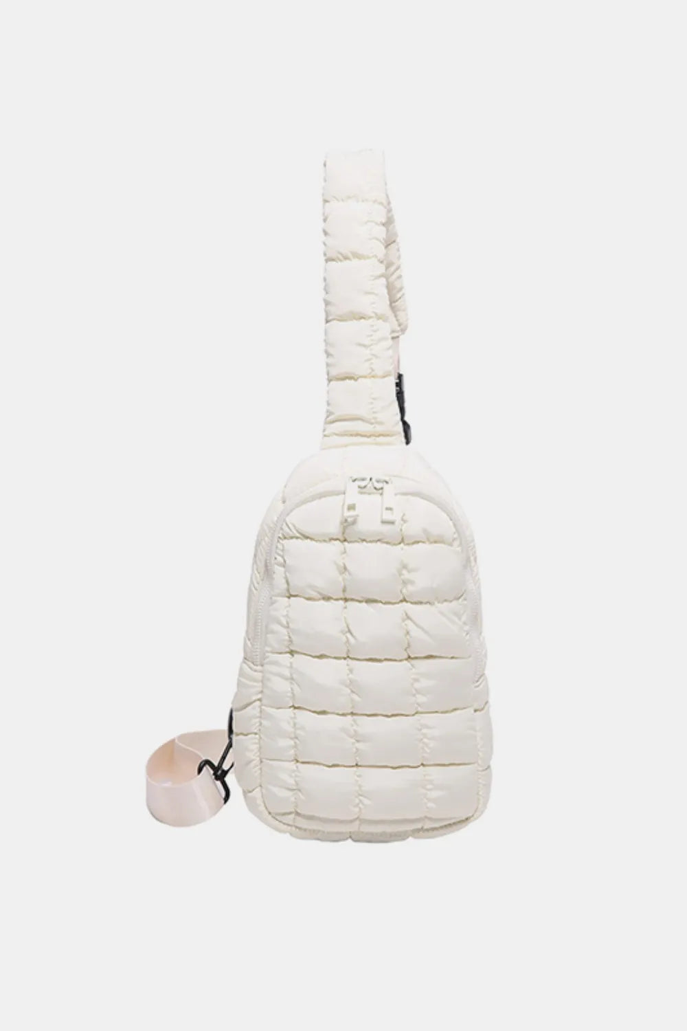 Padded sling bag in ivory with quilted texture and top handle