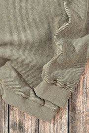 Sage ribbed knit sweater with subtle pinstripe detail and cuffed sleeves.