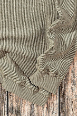 Sage ribbed knit sweater with subtle pinstripe detail and cuffed sleeves.