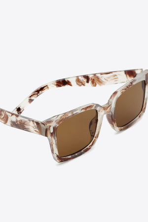 Marble effect rectangular sunglasses with brown lenses and tortoiseshell pattern frames.