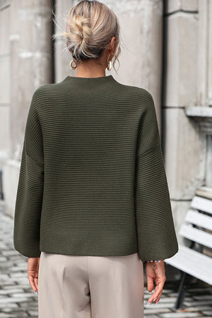Army green ribbed mock neck sweater with volume sleeves.