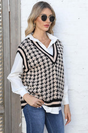 Houndstooth knit v-neck vest in apricot with black trim, acrylic.