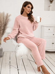 Plush loungewear set in watermelon pink with raglan sleeves and matching pants.