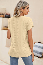 Light Yellow eyelet V-neck top with short sleeves and a casual fit.